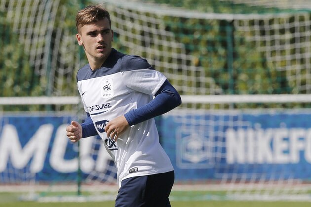 France's soccer player Antoine Griezmann, runs during a training session at the Clairefontaine training center, outside Paris, Wednesday, June 4, 2014. France are preparing for the upcoming soccer World Cup in Brazil starting on 12 June. (AP Photo/Christophe Ena)