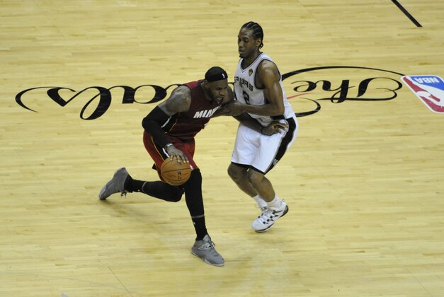 Jun 5, 2014; San Antonio, TX, USA; Miami Heat forward LeBron James (6) drives against San Antonio Spurs forward Kawhi Leonard (2) in game one of the 2014 NBA Finals at AT&T Center. Mandatory Credit: Brendan Maloney-USA TODAY Sports