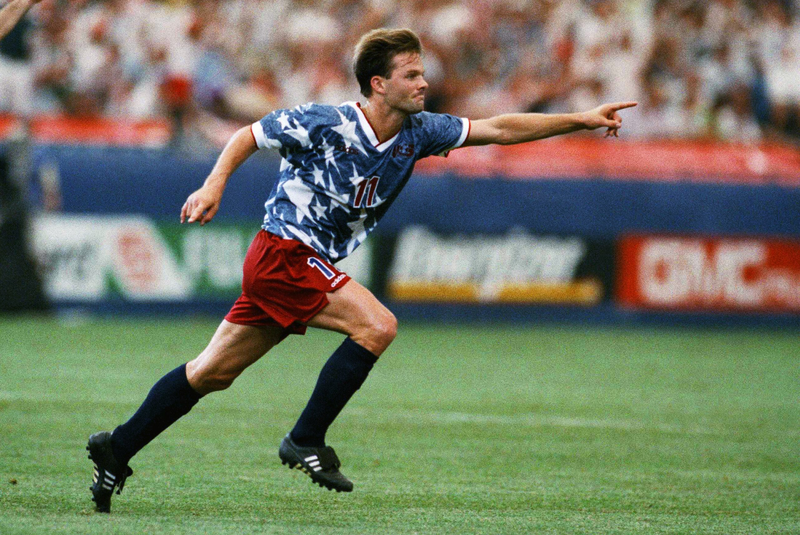 United States national team forward Eric Wynalda, right, reacts after he scored against Switzerland in a World Cup soccer championship Group A first-round match at the Pontiac, Mich., Silverdome on Saturday, June 18, 1994. Teammate Marcelo Balboa joins in the celebration. The United States and Switzerland tied 1-1. (AP Photo/Lennox McLendon)