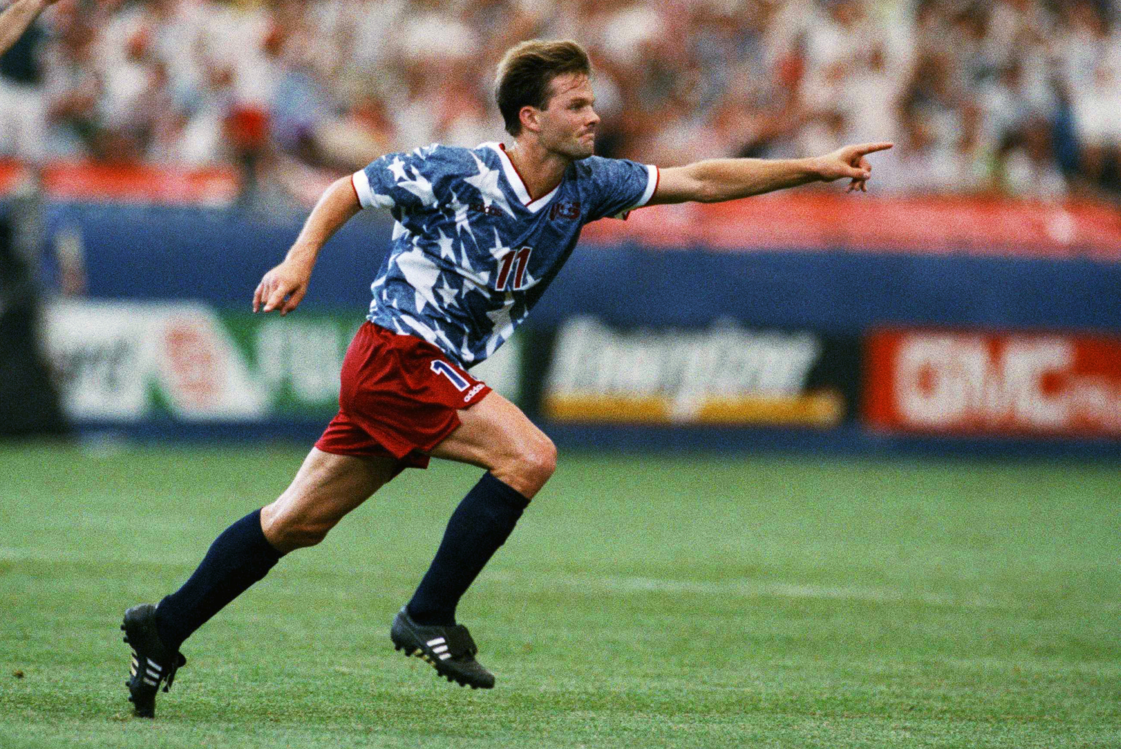 United States national team forward Eric Wynalda, right, reacts after he scored against Switzerland in a World Cup soccer championship Group A first-round match at the Pontiac, Mich., Silverdome on Saturday, June 18, 1994. Teammate Marcelo Balboa joins in the celebration. The United States and Switzerland tied 1-1. (AP Photo/Lennox McLendon)