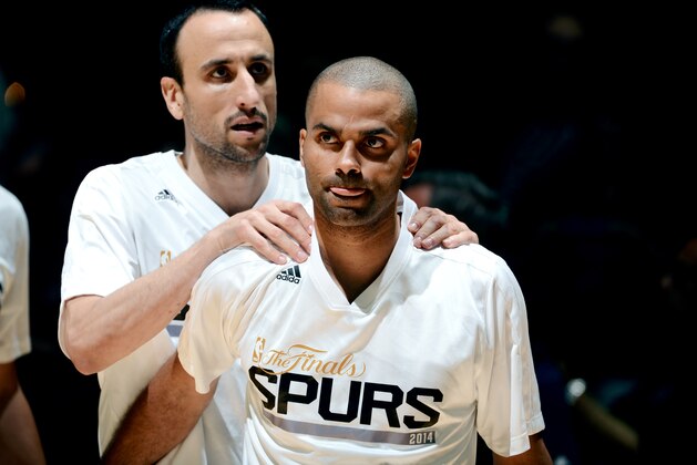 SAN ANTONIO, TX - JUNE 5: Manu Ginobili #20 and Tony Parker #9 of the San Antonio Spurs stand on the court before a game against the Miami Heat in Game One of the 2014 NBA Finals at AT&T Center on June 5, 2014 in San Antonio, Texas. NOTE TO USER: User expressly acknowledges and agrees that, by downloading and/or using this photograph, user is consenting to the terms and conditions of the Getty Images License Agreement.  Mandatory Copyright Notice: Copyright 2014 NBAE (Photo by Garrett Ellwood/NBAE via Getty Images)