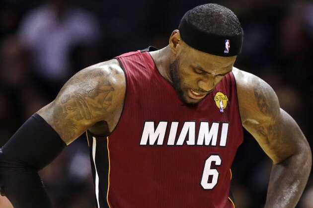 Miami Heat forward LeBron James (6) heads down court between plays against the San Antonio Spurs during the first half in Game 1 of the NBA basketball finals on Thursday, June 5, 2014, in San Antonio. (AP Photo/Eric Gay)