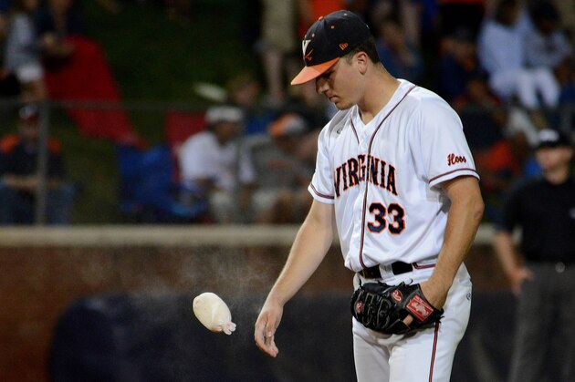 Virginia's Nick Howard prepares to pitch during the ninth inning of an NCAA college baseball regional tournament game against Arkansas in Charlottesville, Va., Saturday, May 31, 2014. (AP Photo/Pat Jarrett)