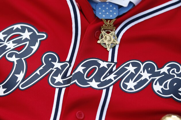 A Medal of Honor winner wears his medal over a special Atlanta Braves jersey as the team horrid seven Medal of Honor winners before a baseball game against the Seattle Mariners Tuesday, June 3, 2014 in Atlanta. (AP Photo/John Bazemore) A Medal of Honor winner wears his medal over a special Atlanta Braves jersey as the team horrid seven Medal of Honor winners before a baseball game against the Seattle Mariners Tuesday, June 3, 2014 in Atlanta. (AP Photo/John Bazemore)
