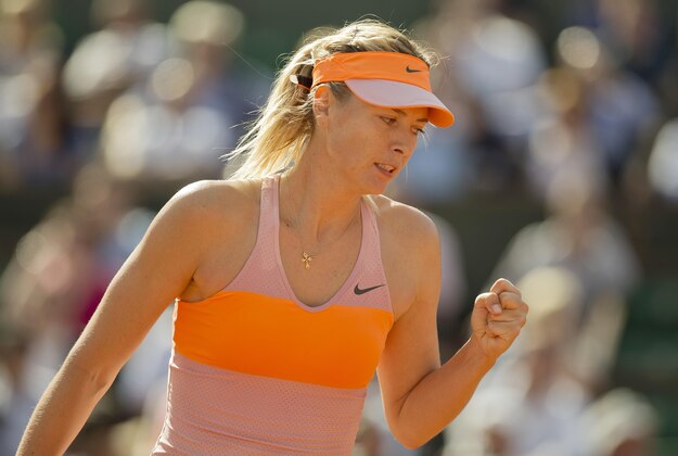 Jun 5, 2014; Paris, France; Maria Sharapova (RUS) reacts during her match against Eugenie Bouchard (CAN) on day 12 at the 2014 French Open at Roland Garros. Mandatory Credit: Susan Mullane-USA TODAY Sports Jun 5, 2014; Paris, France; Maria Sharapova (RUS) reacts during her match against Eugenie Bouchard (CAN) on day 12 at the 2014 French Open at Roland Garros. Mandatory Credit: Susan Mullane-USA TODAY Sports
