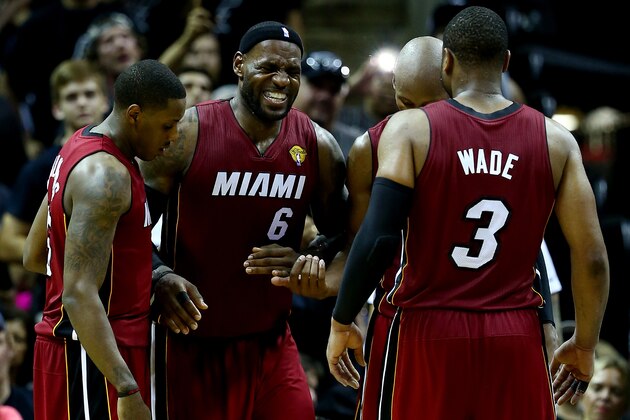 SAN ANTONIO, TX - JUNE 05:  LeBron James #6 of the Miami Heat reacts after cramping up against the San Antonio Spurs during Game One of the 2014 NBA Finals at the AT&T Center on June 5, 2014 in San Antonio, Texas. NOTE TO USER: User expressly acknowledges and agrees that, by downloading and or using this photograph, User is consenting to the terms and conditions of the Getty Images License Agreement.  (Photo by Andy Lyons/Getty Images)