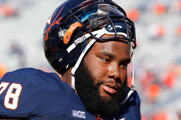 Nov 2, 2013; Charlottesville, VA, USA; Virginia Cavaliers offensive tackle Morgan Moses (78) stands on the field prior to the Cavaliers game against the Clemson Tigers at Scott Stadium. Mandatory Credit: Geoff Burke-USA TODAY Sports