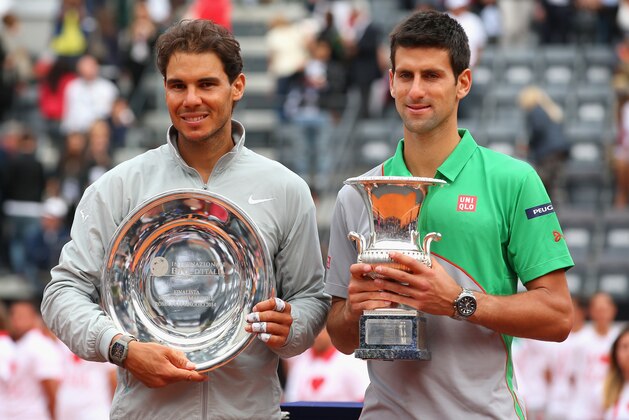 ROME, ITALY - MAY 18:  Novak Djokovic of Serbia with the winners trophy next to runner up Rafael Nadal of Spain after the final during day eight of the Internazionali BNL d'Italia tennis 2014 on May 18, 2014 in Rome, Italy.  (Photo by Julian Finney/Getty Images)