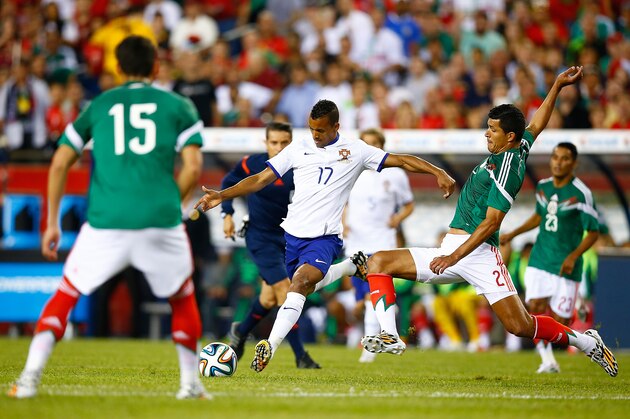FOXBORO, MA - JUNE 06: Francisco Rodriguez #2 of Mexico defends the shot by Nani #17 of Portugal in the first half during the international friendly match at Gillette Stadium on June 6, 2014 in Foxboro, Massachusetts.  (Photo by Jared Wickerham/Getty Images)