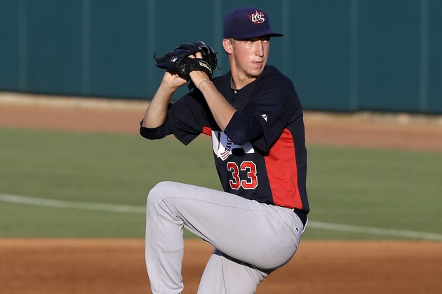 United States pitcher Erick Fedde (33) throws duringan exhibition baseball game against Cuba in Cary, N.C., Monday, July 22, 2013. (AP Photo/Gerry Broome)