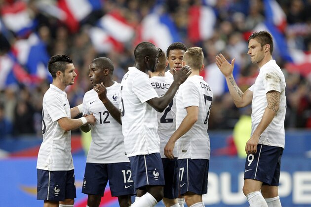 French soccer players celebrate after defeating Norway during their friendly soccer match at the Stade de France stadium in Saint Denis, outside Paris, Tuesday, May 27, 2014.  France are preparing for the upcoming soccer World Cup in Brazil starting on 12 June. (AP Photo/Christophe Ena)