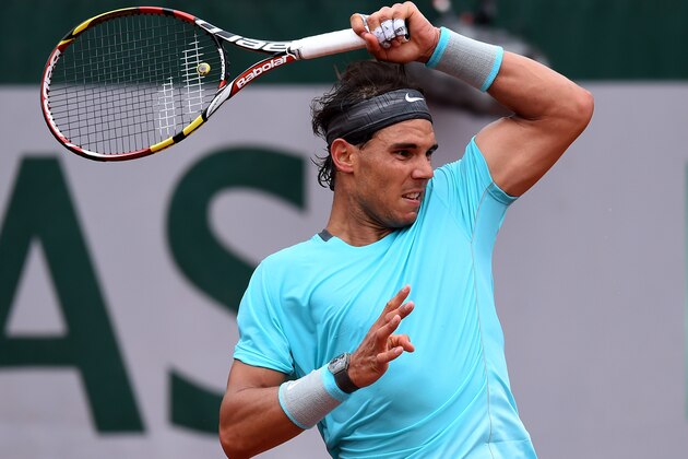 PARIS, FRANCE - MAY 26:  Rafael Nadal of Spain returns a shot during his men's singles match against Robby Ginepri of the United States on day two of the French Open at Roland Garros on May 26, 2014 in Paris, France.  (Photo by Matthias Hangst/Getty Images)