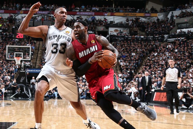 SAN ANTONIO, TX - JUNE 5: LeBron James #6 of the Miami Heat drives against Boris Diaw #33 of the San Antonio Spurs in Game One of the 2014 NBA Finals at AT&T Center on June 5, 2014 in San Antonio, Texas. NOTE TO USER: User expressly acknowledges and agrees that, by downloading and/or using this photograph, user is consenting to the terms and conditions of the Getty Images License Agreement.  Mandatory Copyright Notice: Copyright 2014 NBAE (Photo by Nathaniel S. Butler/NBAE via Getty Images)