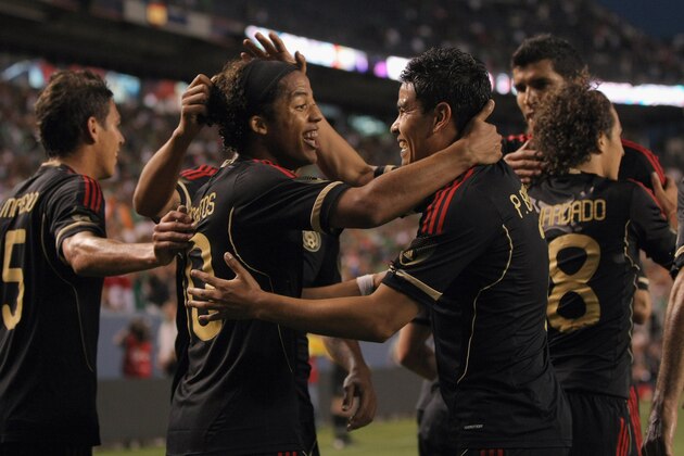 DENVER, CO - JUNE 01:  Giovani Dos Santos #10 of Mexico celebrates his second goal of the game with Pablo Barrera #7 in the 30th minute against New Zealand at INVESCO Field at Mile High on June 1, 2011 in Denver, Colorado.  (Photo by Doug Pensinger/Getty Images)