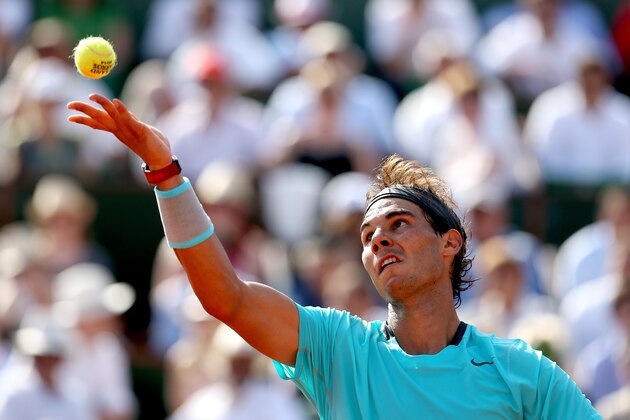PARIS, FRANCE - JUNE 06:  Rafael Nadal of Spain serves during his men's singles match against Andy Murray of Great Britain on day thirteen of the French Open at Roland Garros on June 6, 2014 in Paris, France.  (Photo by Matthew Stockman/Getty Images)