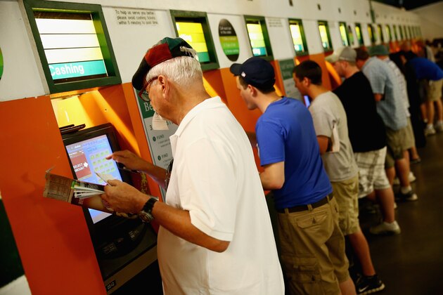 ELMONT, NY - JUNE 07:  Fans place bets prior to the Belmont Stakes at Belmont Park on June 7, 2014 in Elmont, New York.  (Photo by Streeter Lecka/Getty Images)