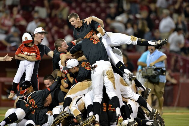 The Maryland Terrapins celebrate during an NCAA college baseball regional tournament game against South Carolina in Columbia, S.C.,  Sunday, June 1, 2014.  Maryland won 10-1. (AP Photo/ Richard Shiro)