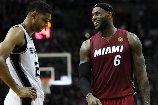 Jun 5, 2014; San Antonio, TX, USA; Miami Heat forward LeBron James (6) talks to San Antonio Spurs forward Tim Duncan (21) during the second quarter in game one of the 2014 NBA Finals at AT&T Center. Mandatory Credit: Soobum Im-USA TODAY Sports