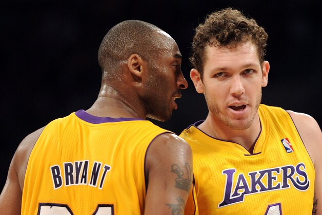 LOS ANGELES, CA - JANUARY 04:  Kobe Bryant #24 of the Los Angeles Lakers and Luke Walton #4 talk during the game against the Detroit Pistons at the Staples Center on January 4, 2011 in Los Angeles, California. NOTE TO USER: User expressly acknowledges and agrees that, by downloading and or using this photograph, User is consenting to the terms and conditions of the Getty Images License Agreement.  (Photo by Harry How/Getty Images)