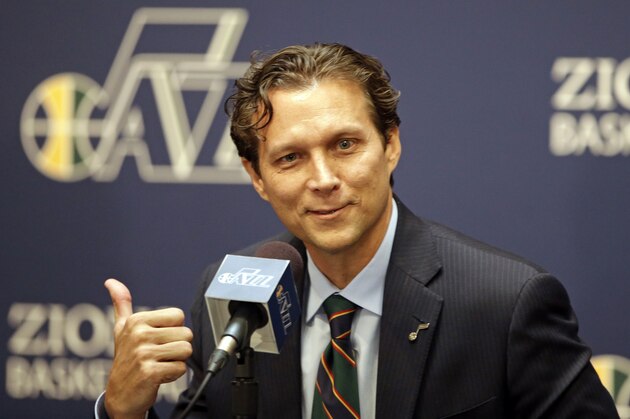 Quin Snyder gestures fter being introduced as the new Utah Jazz head coach during an NBA basketball news conference Saturday, June 7, 2014, in Salt Lake City. The Jazz announced Friday that they hired the Atlanta Hawks assistant coach to replace Tyrone Corbin, who was let go earlier this year after three-plus seasons in Salt Lake City.  (AP Photo/Rick Bowmer)
