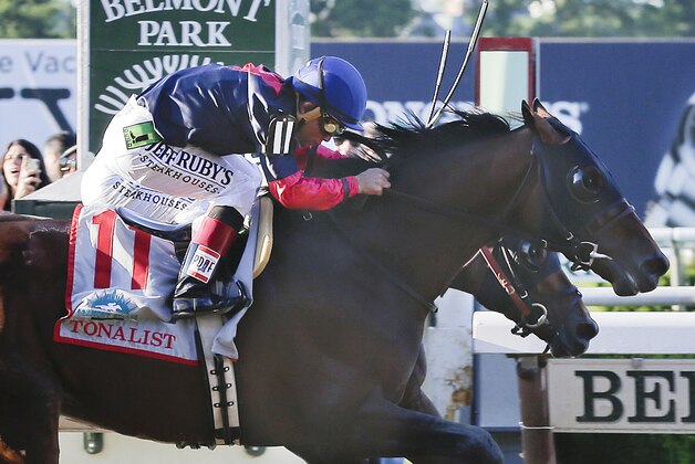 Tonalist (11) with Joel Rosario up edges out Commissioner with Javier Castellano up to win the 146th running of the Belmont Stakes horse race, Saturday, June 7, 2014, in Elmont, N.Y. Belmont Stakes horse race, Saturday, June 7, 2014, in Elmont, N.Y. (AP Photo/Peter Morgan)