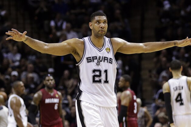 San Antonio Spurs forward Tim Duncan (21) walks down court at a break against the Miami Heat during the first half in Game 1 of the NBA basketball finals on Thursday, June 5, 2014, in San Antonio. (AP Photo/Eric Gay)
