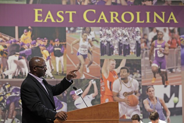 East Carolina coach Ruffin McNeill speaks to reporters during football media day in Greenville, N.C., Saturday, Aug. 6, 2011. (AP Photo/Gerry Broome)
