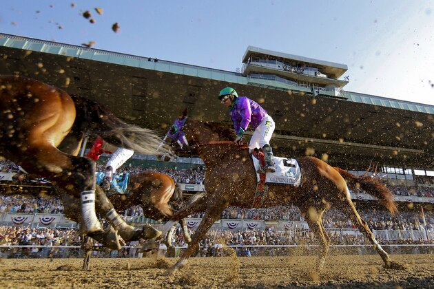 California Chrome with Victor Espinoza up finishes fourth in the Belmont Stakes horse race, Saturday, June 7, 2014, in Elmont, N.Y. (AP Photo/Matt Slocum)