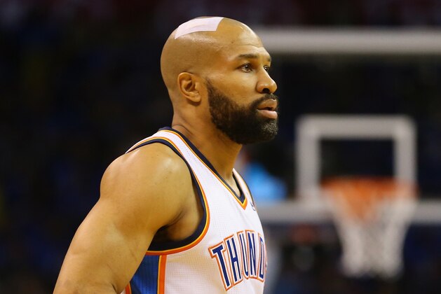 OKLAHOMA CITY, OK - MAY 25: Derek Fisher #6 of the Oklahoma City Thunder looks on with a bandage on his head in the third quarter against the San Antonio Spurs  during Game Three of the Western Conference Finals of the 2014 NBA Playoffs at Chesapeake Energy Arena on May 25, 2014 in Oklahoma City, Oklahoma.  (Photo by Ronald Martinez/Getty Images)