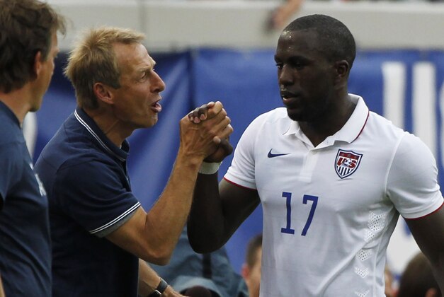Jun 7, 2014; Jacksonville, FL, USA; United States forward Jozy Altidore (17) is congratulated by head coach Jurgen Klinsmann (hc) as he was taken out of the game against the Nigeria during the second half at EverBank Field. United States defeated Nigeria 2-1. Mandatory Credit: Kim Klement-USA TODAY Sports