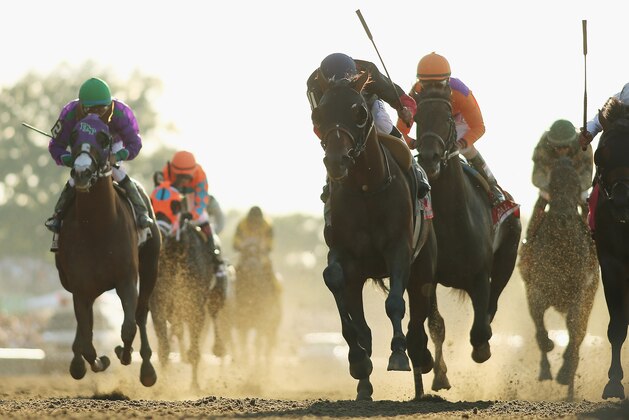 ELMONT, NY - JUNE 07:  Tonalist #11, ridden by Joel Rosario, races to the finish line enroute to winning the 146th running of the Belmont Stakes at Belmont Park on June 7, 2014 in Elmont, New York.  (Photo by Rob Carr/Getty Images)