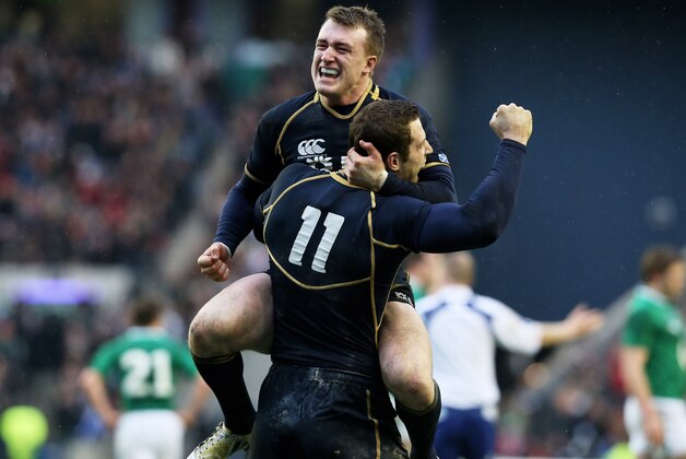 EDINBURGH, SCOTLAND - FEBRUARY 24:  Scotland teammates Tim Visser (#11) and Stuart Hogg celebrate their team's victory as the final whistle blows during the RBS Six Nations match between Scotland and Ireland at Murrayfield Stadium on February 24, 2013 in Edinburgh, Scotland.  (Photo by David Rogers/Getty Images)