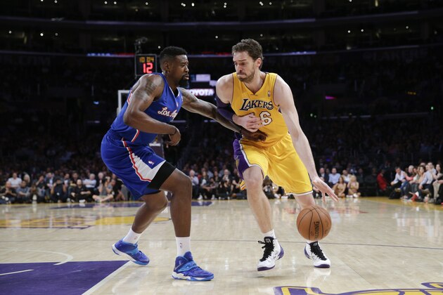 Los Angeles Lakers' Pau Gasol, right, of Spain, is defended by Los Angeles Clippers' DeAndre Jordan during the first half of an NBA basketball game on Thursday, March 6, 2014, in Los Angeles. (AP Photo/Jae C. Hong)