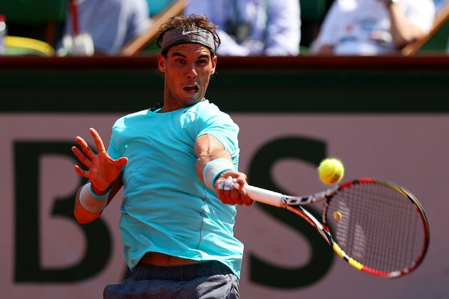 PARIS, FRANCE - JUNE 08:  Rafael Nadal of Spain returns a shot during his men's singles final match against Novak Djokovic of Serbia on day fifteen of the French Open at Roland Garros on June 8, 2014 in Paris, France.  (Photo by Clive Brunskill/Getty Images)