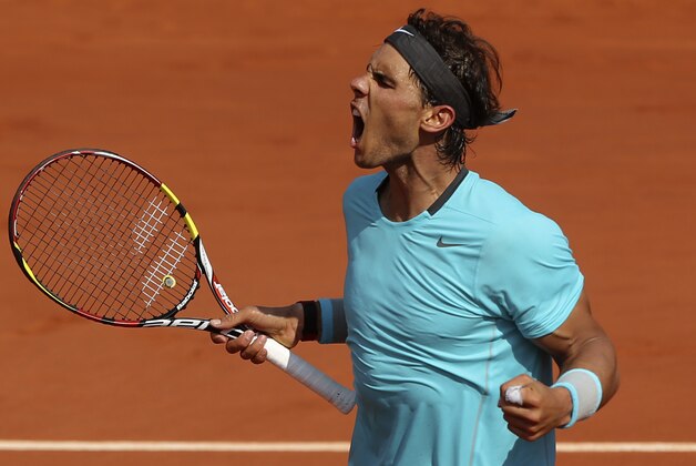 Spain's Rafael Nadal reacts as he wins  the second set against Serbia's Novak Djokovic during their final match of  the French Open tennis tournament at the Roland Garros stadium, in Paris, France, Sunday, June 8, 2014. (AP Photo/Thibault Camus)