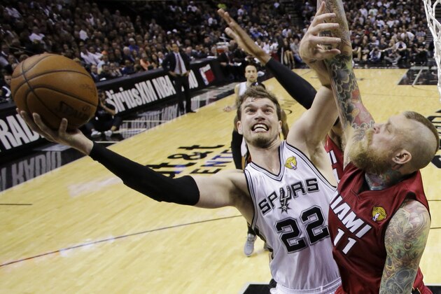 San Antonio Spurs center Tiago Splitter (22) shoots as Miami Heat forward Chris Andersen (11) defends during the first half in Game 1 of the NBA basketball finals on Thursday, June 5, 2014, in San Antonio. (AP Photo/Eric Gay)