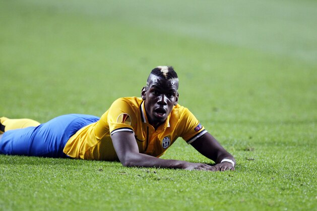 Juventus' Paul Pogba looks on as he lies on the pitch during the Europa League semifinal first leg soccer match between Benfica and Juventus at Benfica's Luz stadium in Lisbon, Thursday, April 24, 2014. (AP Photo/Francisco Seco)