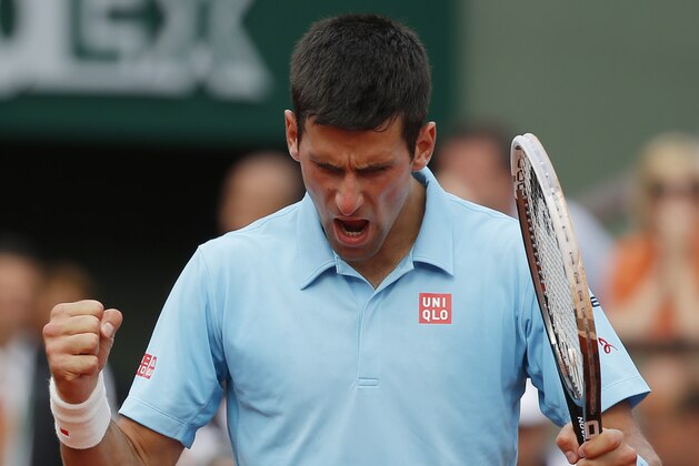 Serbia's Novak Djokovic reacts after a winning point as he plays Spain's Rafael Nadal during their final match of  the French Open tennis tournament at the Roland Garros stadium, in Paris, France, Sunday, June 8, 2014. (AP Photo/Michel Euler)