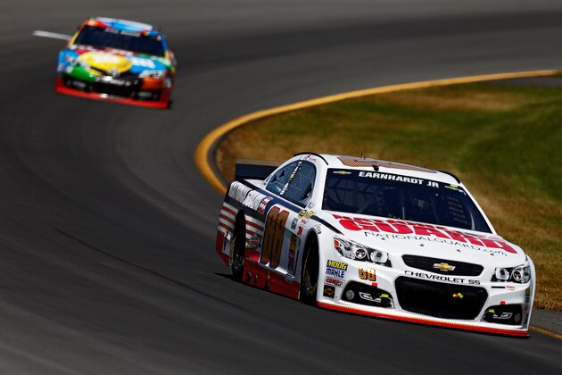 LONG POND, PA - JUNE 08:  Dale Earnhardt Jr., driver of the #88 National Guard Chevrolet, leads Kyle Busch, driver of the #18 M&M's Peanut Butter Toyota, during the NASCAR Sprint Cup Series Pocono 400 at Pocono Raceway on June 8, 2014 in Long Pond, Pennsylvania.  (Photo by Jeff Zelevansky/Getty Images)