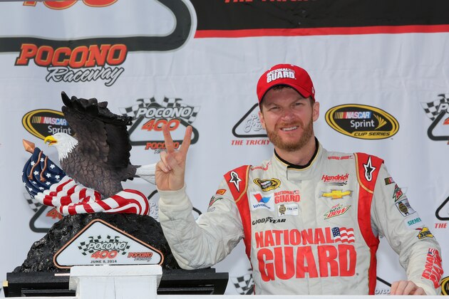 LONG POND, PA - JUNE 08:  Dale Earnhardt Jr., driver of the #88 National Guard Chevrolet, poses in Victory Lane with the winner's trophy after winning the NASCAR Sprint Cup Series Pocono 400 at Pocono Raceway on June 8, 2014 in Long Pond, Pennsylvania.  (Photo by Jerry Markland/Getty Images)