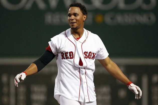 Boston Red Sox's Xander Bogaerts appears disheveled after being mobbed by teammates after his game-winning hit against the Atlanta Braves during the ninth inning of their 4-3 win in a baseball game at Fenway Park in Boston, Thursday, May 29, 2014. (AP Photo/Winslow Townson)