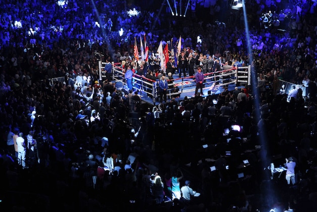 Jun 7, 2014; New York, NY, USA; Sergio Martinez and  Miguel Cotto are introduced before the first round of WBC World Middleweight fight at Madison Square Garden. Mandatory Credit: Noah K. Murray-USA TODAY Sports