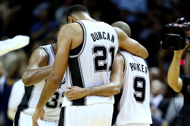 SAN ANTONIO, TX - JUNE 05:  Tim Duncan #21 and Tony Parker #9 of the San Antonio Spurs celebrate after defeating the Miami Heat 110-95 in Game One of the 2014 NBA Finals at the AT&T Center on June 5, 2014 in San Antonio, Texas. NOTE TO USER: User expressly acknowledges and agrees that, by downloading and or using this photograph, User is consenting to the terms and conditions of the Getty Images License Agreement.  (Photo by Andy Lyons/Getty Images)