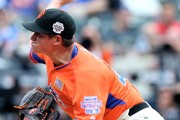 NEW YORK, NY - JULY 14:  Kyle Crick #49 of the United States delivers a pitch against the World Team on July 14, 2013 at Citi Field in the Flushing neighborhood of the Queens borough of New York City. The United States defeated the World Team 4-2.  (Photo by Elsa/Getty Images)