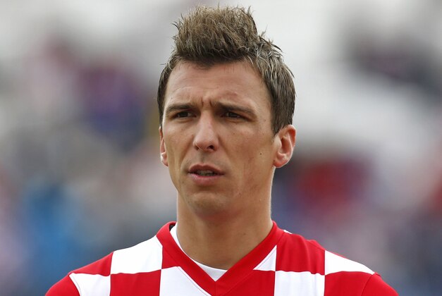 Croatia's Mario Mandzukic listens to the national anthem ahead of the international soccer friendly match between Croatia and Mali, in Osijek, Croatia, Saturday, May 31, 2014. (AP Photo/Darko Bandic)