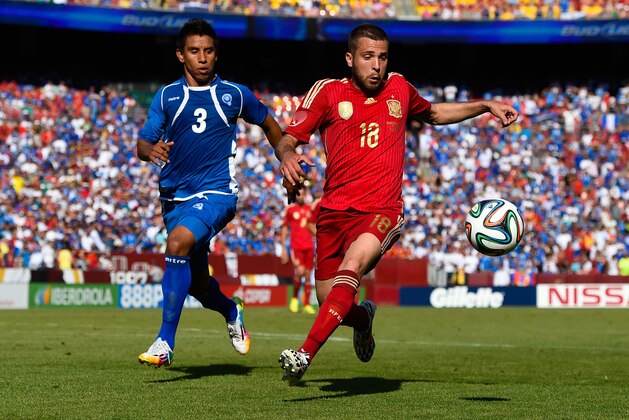 LANDOVER, MD - JUNE 07:  Jordi Alba of Spain duels for the ball with Molina Milton of El Salvador during an international friendly match between El Salvador and Spain at FedExField on June 7, 2014 in Landover, Maryland.  (Photo by David Ramos/Getty Images)