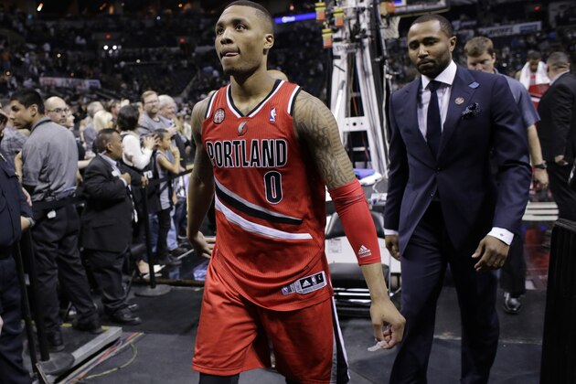 Portland Trail Blazers' Damian Lillard (0) walks off the court following the team's loss in Game 5 of a Western Conference semifinal NBA basketball playoff series, Wednesday, May 14, 2014, in San Antonio. San Antonio won 104-82. (AP Photo/Eric Gay)