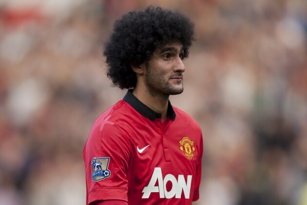 Manchester United's Marouane Fellaini walks from the pitch after his team's English Premier League soccer match against West Bromwich Albion at Old Trafford Stadium, Manchester, England, Saturday Sept. 28, 2013. (AP Photo/Jon Super)