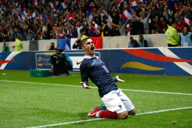 French soccer team forward Antoine Griezmann, reacts after scoring against Paraguay during their friendly soccer match, at the Allianz Riviera Stadium, in Nice, southeastern France, Sunday, June 1, 2014. France is preparing for the upcoming soccer World Cup in Brazil starting on 12 June. (AP Photo/Claude Paris)