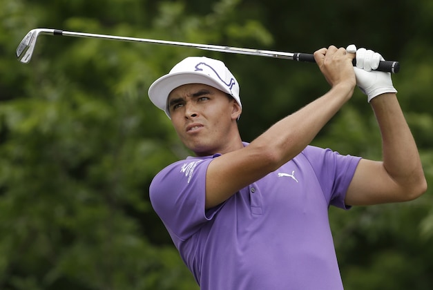 Rickie Fowler watches his tee shot on the eighth hole during the second round of the PGA Colonial golf tournament in Fort Worth, Texas, Friday, May 23, 2014. (AP Photo/LM Otero)